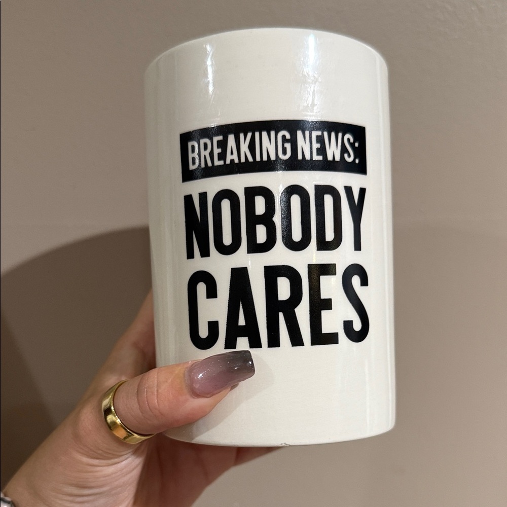 White ceramic makeup brush holder with Bold Black Text